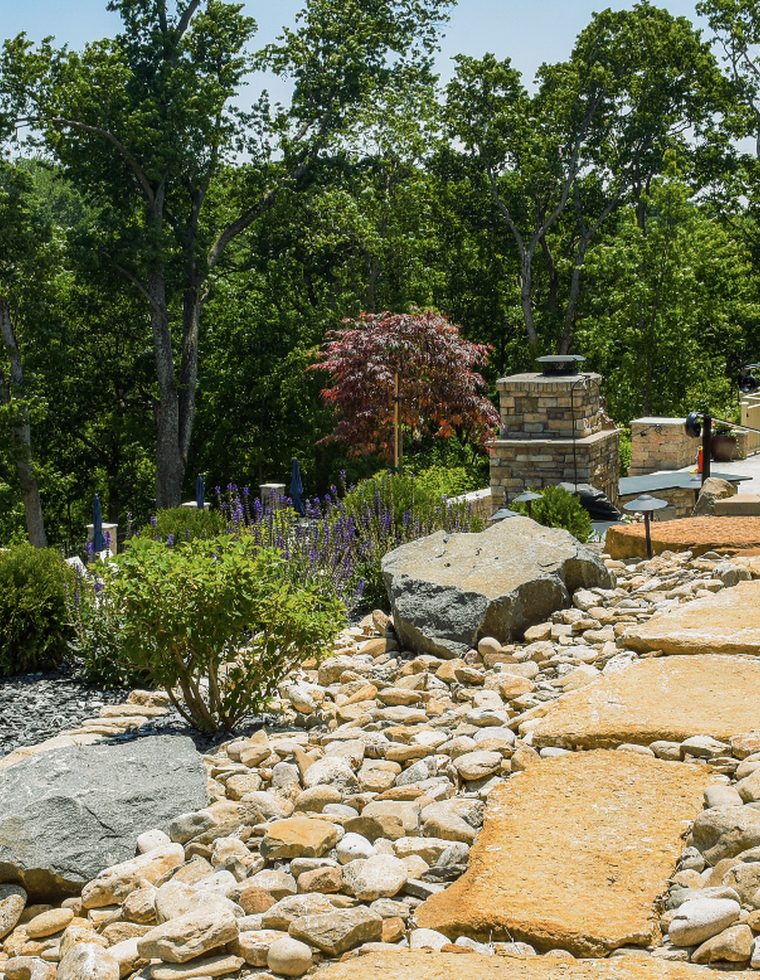 Hand-weeding a garden bed in Worcester, MA